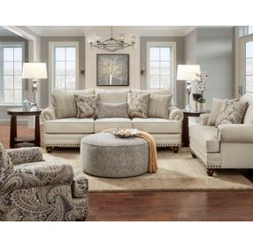 Cary's Doe Beige Upholstered Accent Chair with Nailhead Trim and Throw Pillows