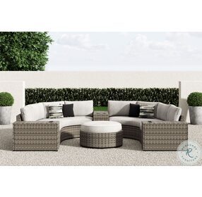 Calworth Beige 7 Piece Outdoor Sectional with Ottoman